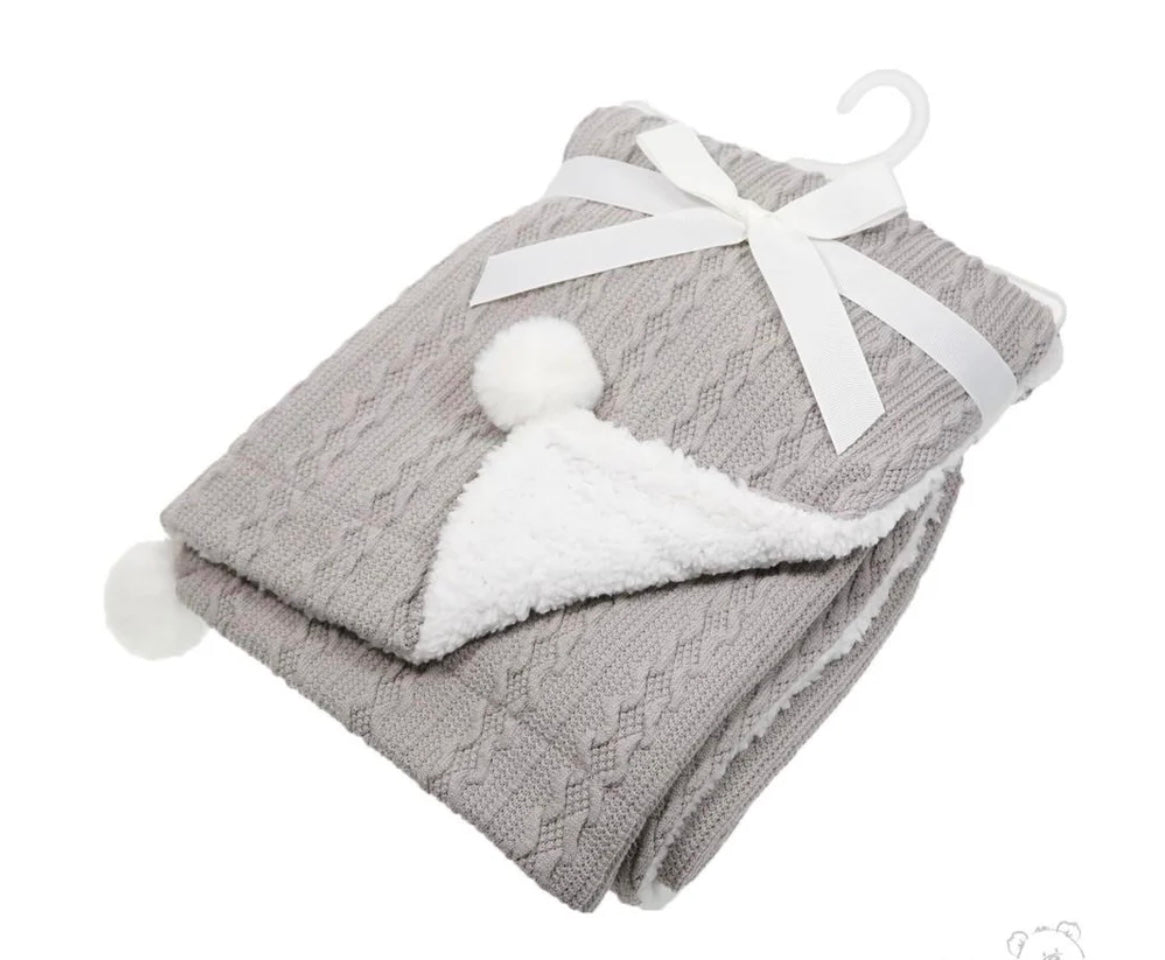 Personalised cable knit baby blanket with Pom Poms